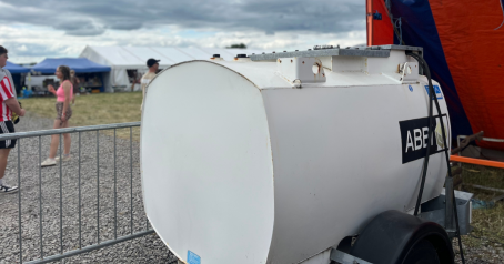 Close up of a white 950L road tow fuel bowser at a festival. The featured image for article HVO vs diesel.